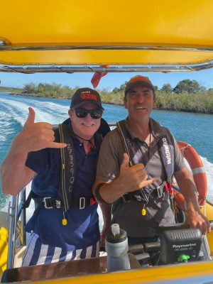 a man and a woman sitting on a boat